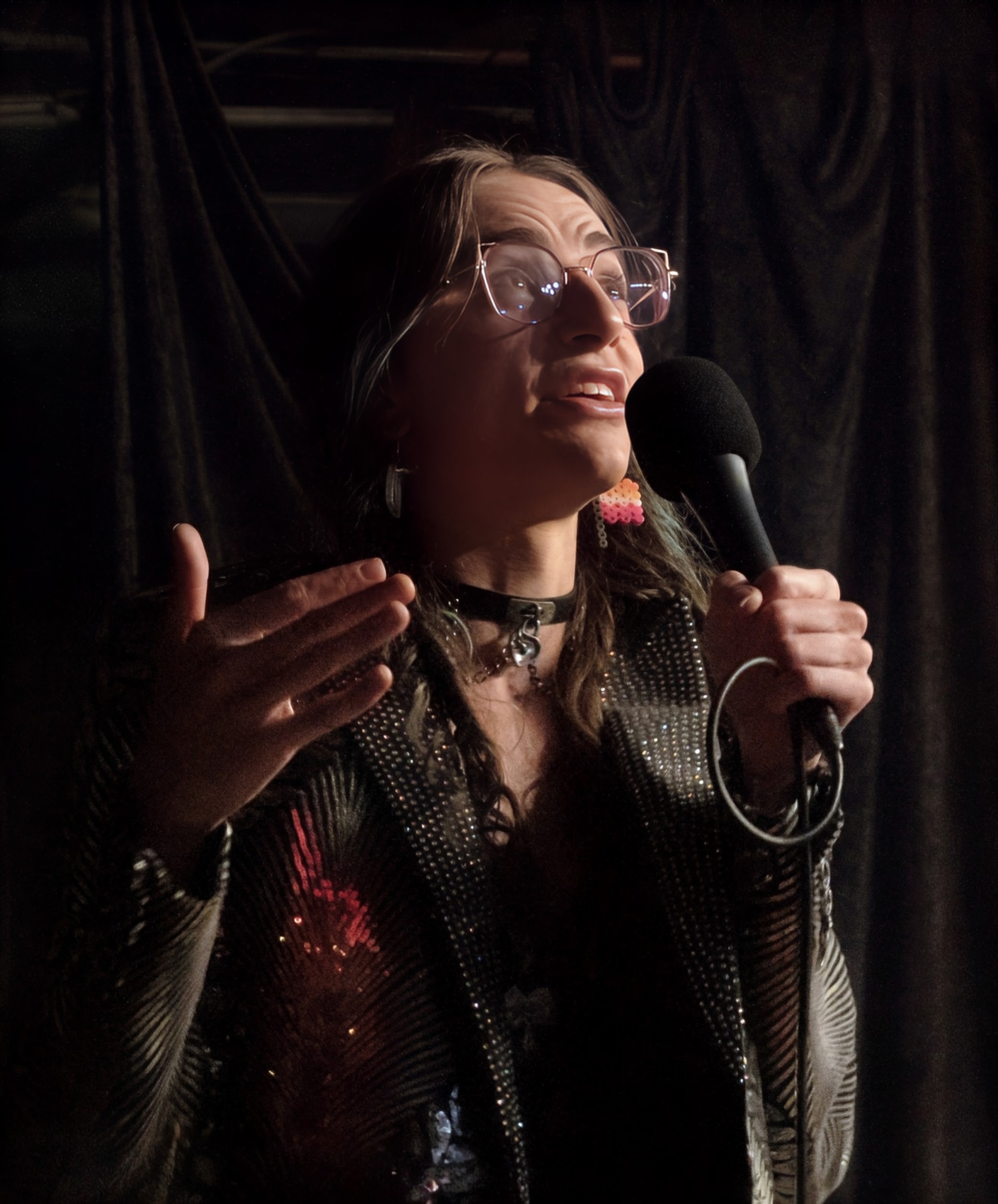 Mercy Hawkins hosting a QTs & Cuties comedy show